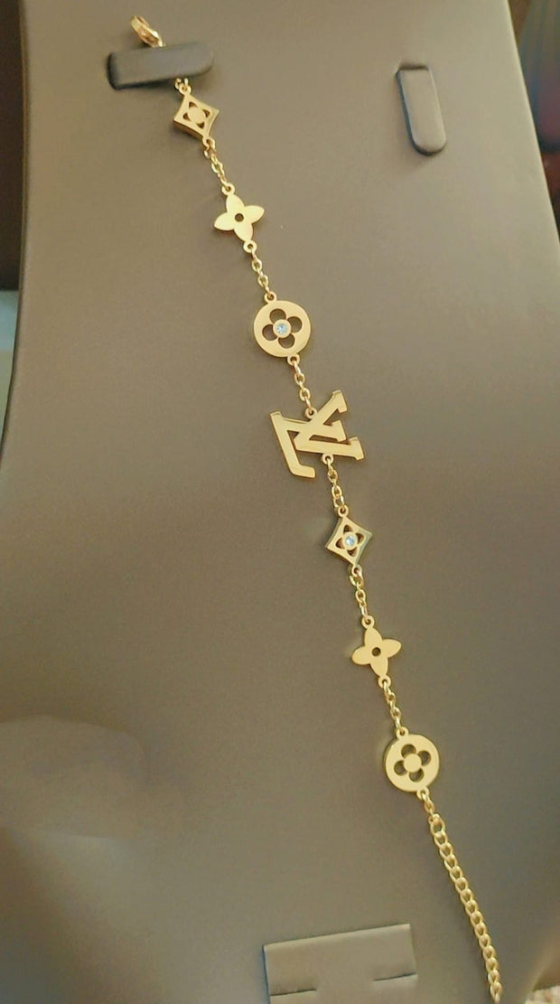 Tory Burch and Lv bracelet
